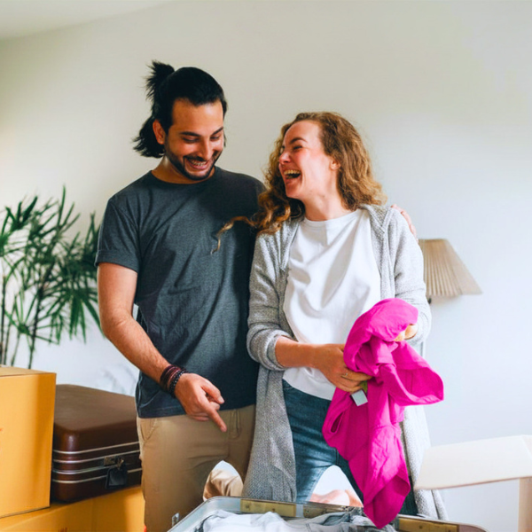Happy couple moving into their new home